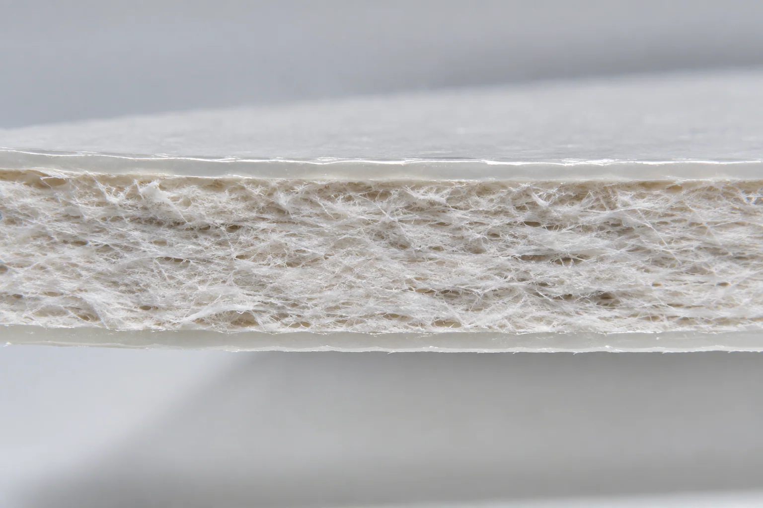 Cross-section of coated white paperboard with double PE layers for ice cream cups